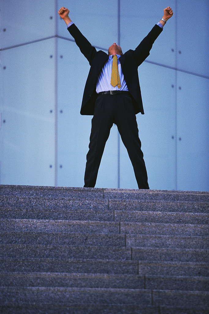 Businessman Raising Arms